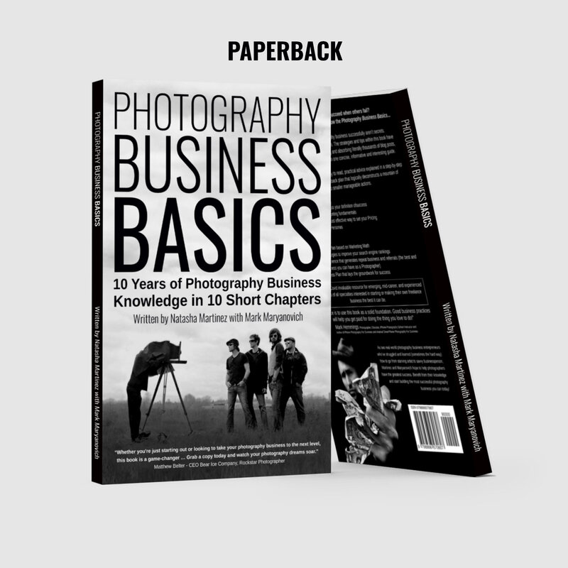 Two copies of Photography Business Basics Book standing on display front cover facing flush back cover leaning angled against first copy in black and white