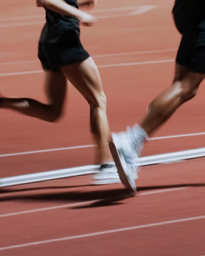 Group of athletes training together with injury prevention and muscle performance in focus