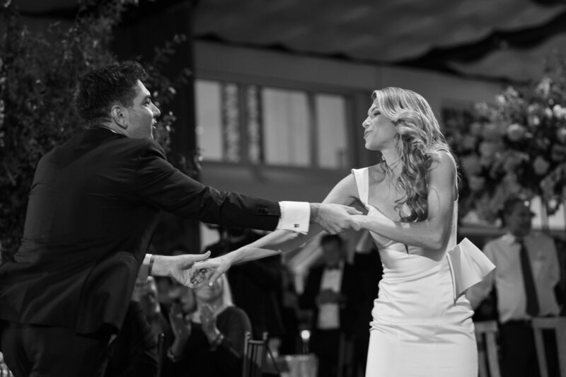 Black and white image of a bride and groom first dance