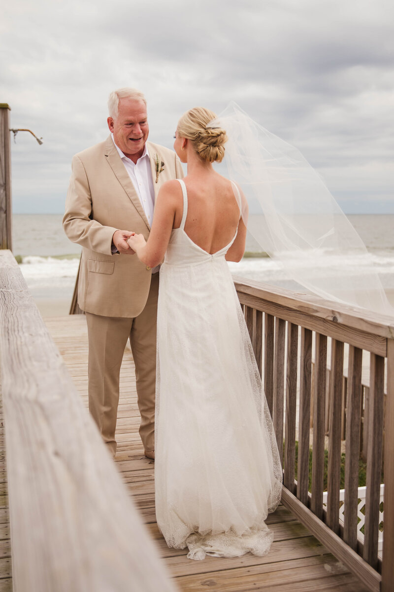 bride seeing father for first time on wedding day