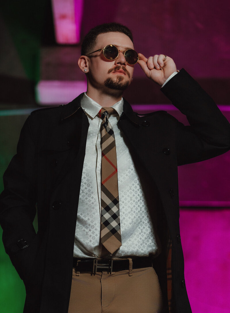 Moody portrait with cinematic lighting setup by Lansing branding photographer.


