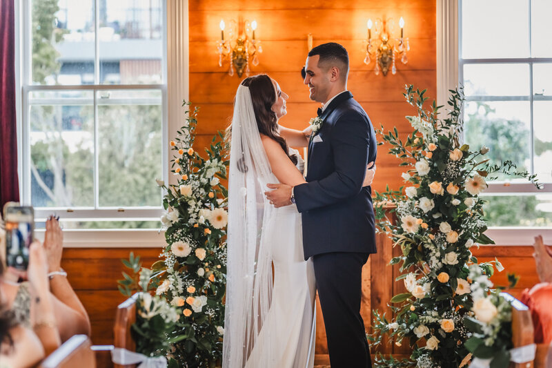 small wedding ceremony at charming Auckland little white chapel