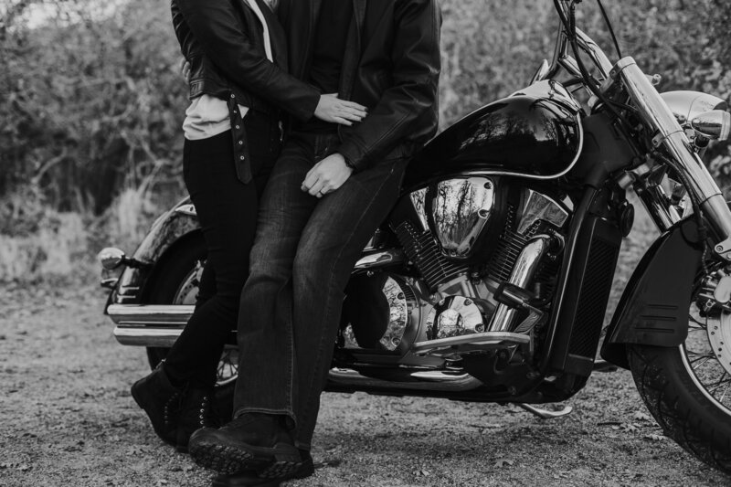 young couple sitting on motorcycle during Knoxville engagement session