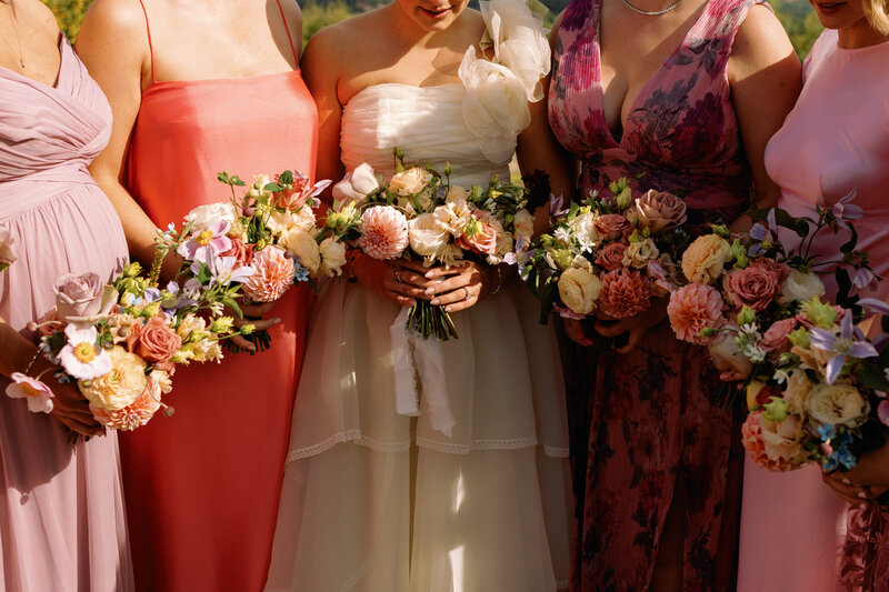 gorgeous pink bridemaids dresses and bouquets detail wedding photo