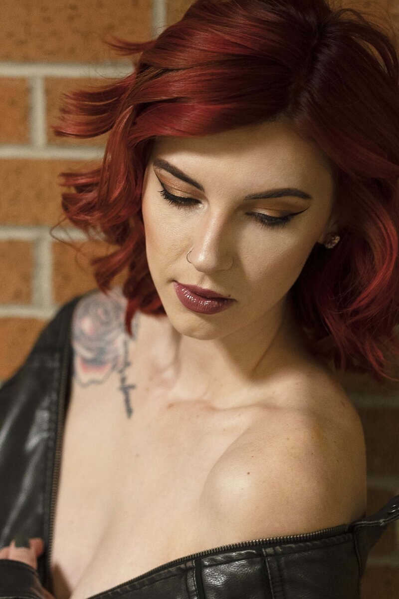 Colorado Springs Boudoir Photographer woman with tattoos in leather jacket