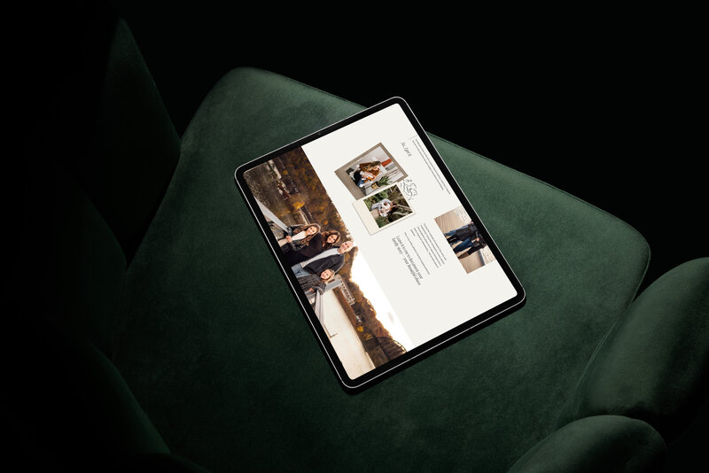 A tablet displaying a website with family photos and text, showcasing small business website design services, rests on a dark green chair.