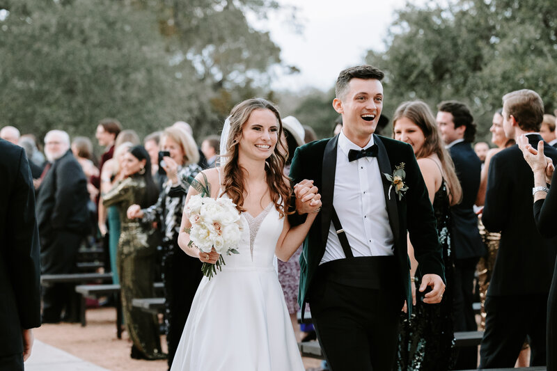 Photo of Bride and Groom during  recessional in Spring Branch Texas