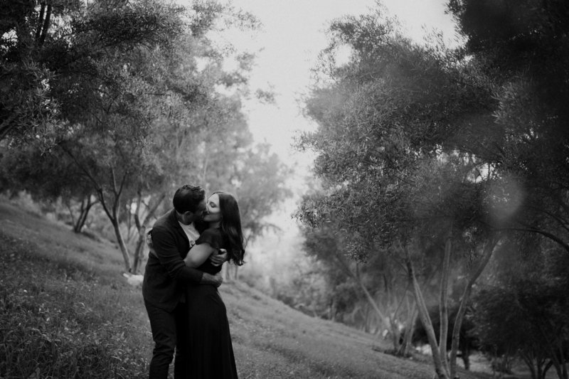 couple kissing in a park