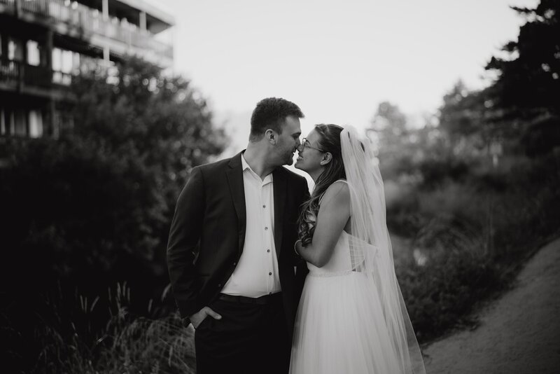 a bride and groom touching noses