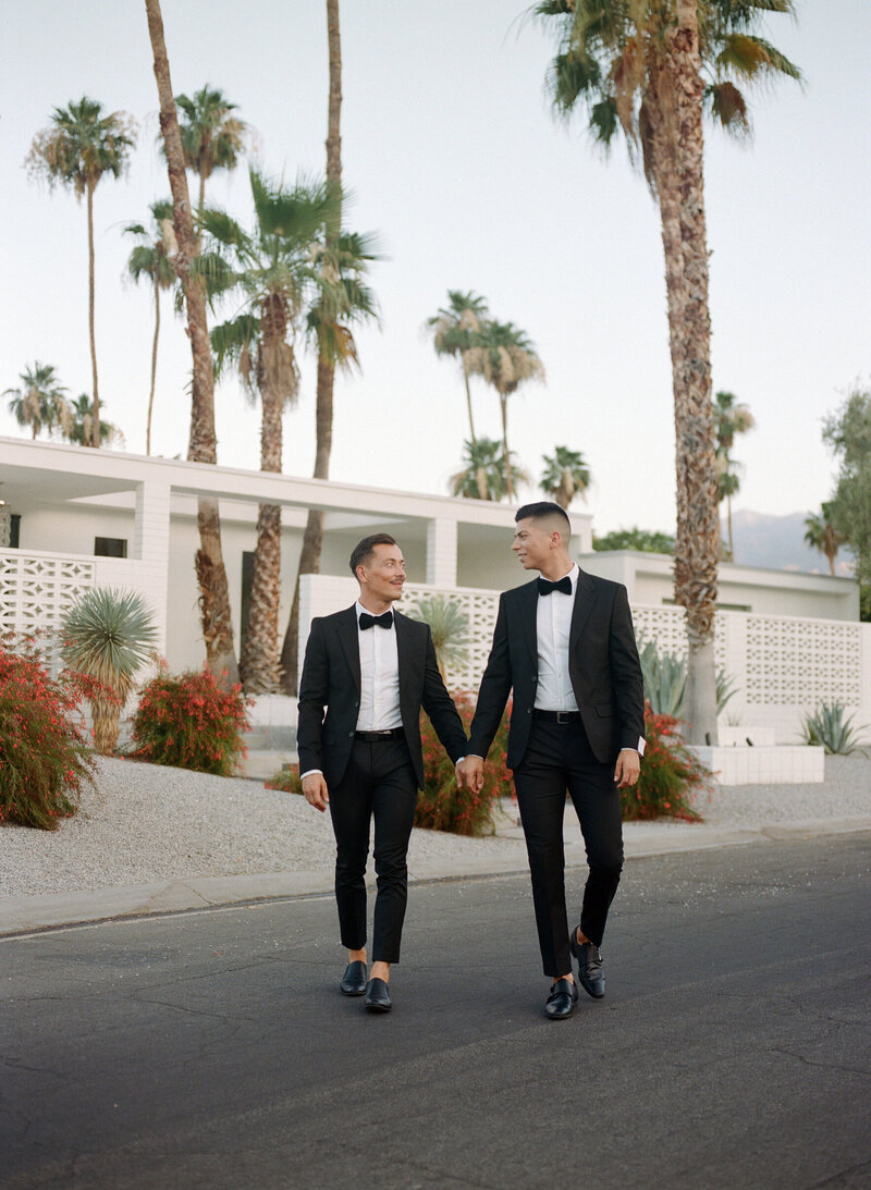 Couple with mid century homes in Palm Springs, California