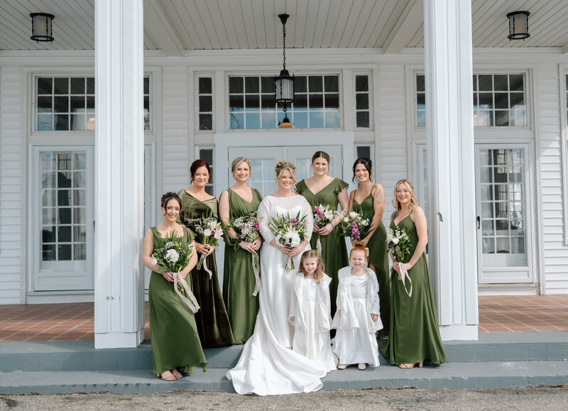 bride and bridesmaids in green