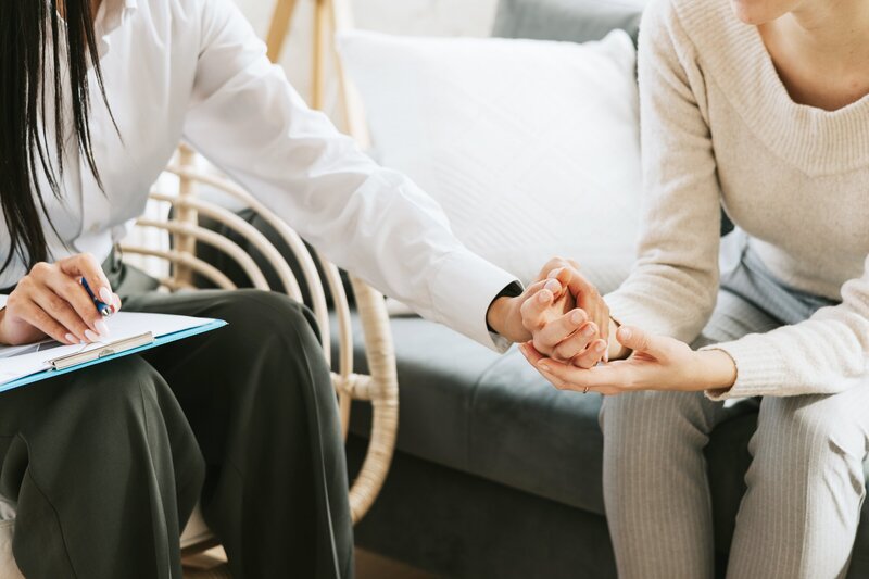 Grabbing person's hand in support