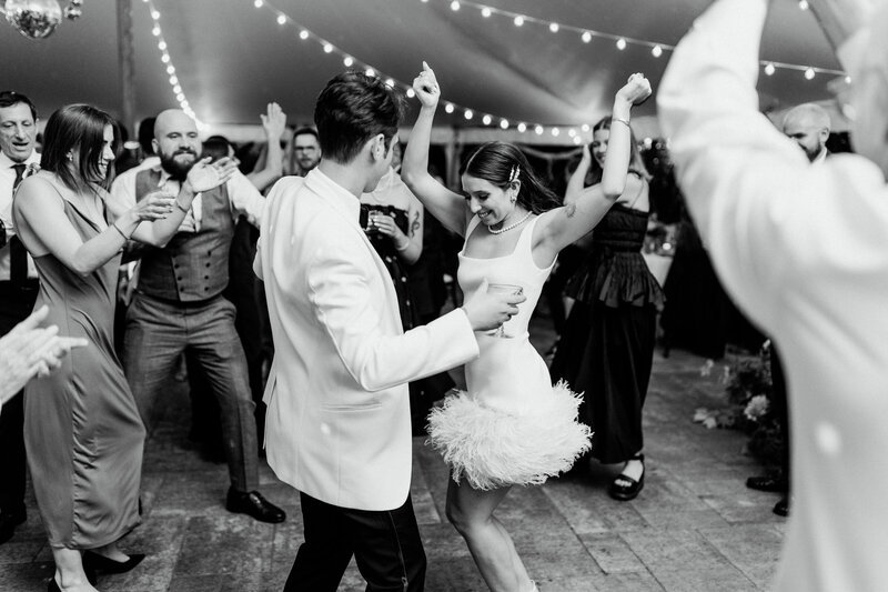 Bride and groom dance together during wedding reception at The Bradley Estate in Massachusetts