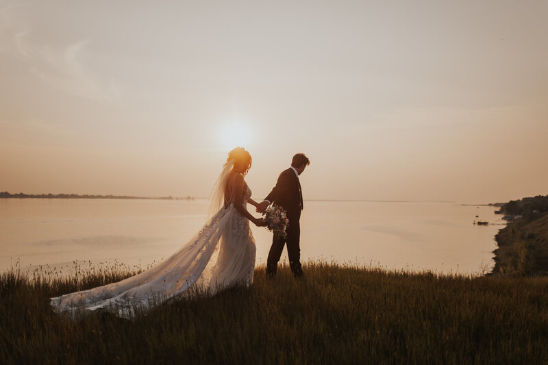 A sunset intimate wedding beside the lake in Saskatchewan