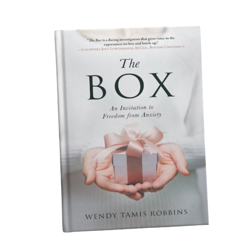 The Box book cover with person's hands holding a box with a pink ribbon