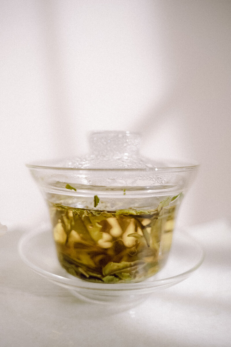Tea brewing in glass gaiwan teapot for a brand consultancy session