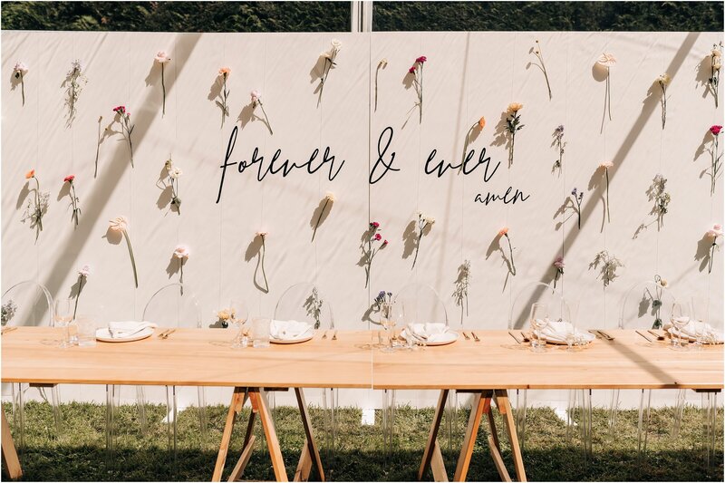 flower wall install behind bridal table in clear loula marquee christchurch forever and ever amen