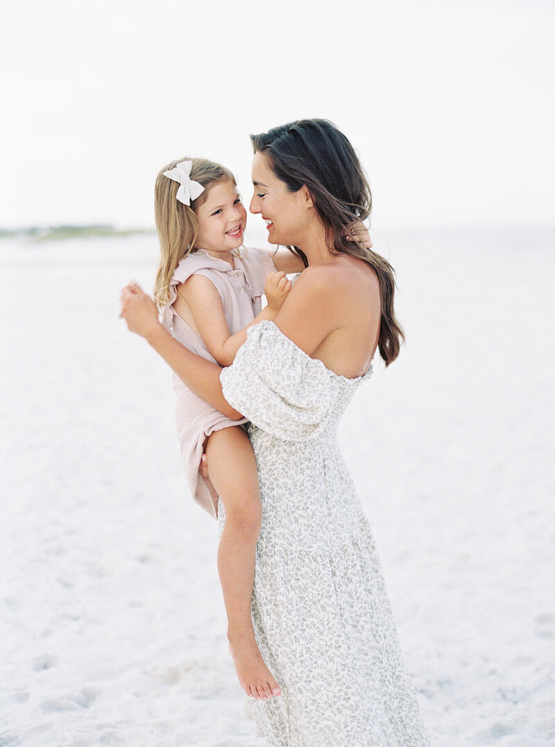 Mother and daughter embracing  during a 30A beach session