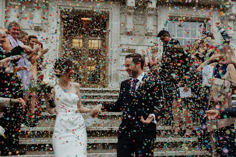 Bride and groom with confetti  at Hackney town hall