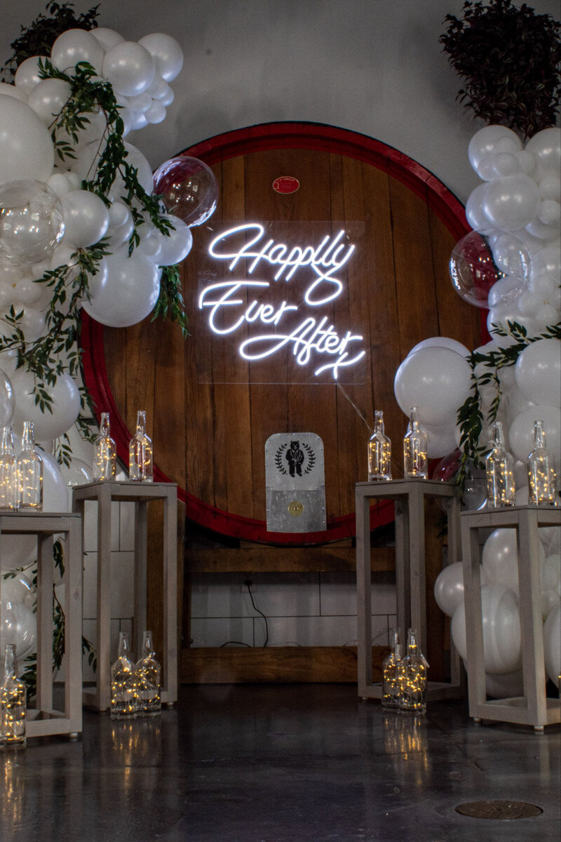 Wedding altar design with balloons, greenery and candles