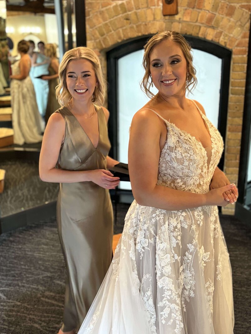 Bride getting ready with professional makeup artist for her wedding day in Mankato, MN.