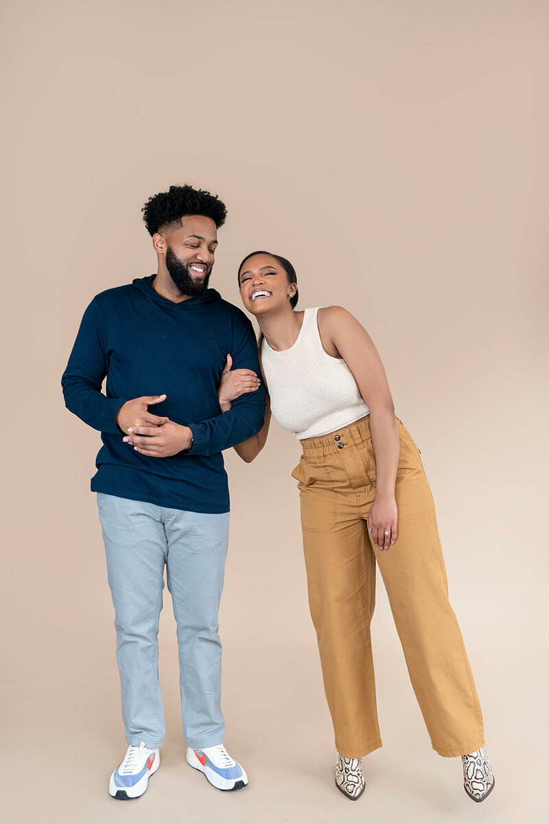 Owner's of Pharris Photography, Josh and Karris Pharris smiling.