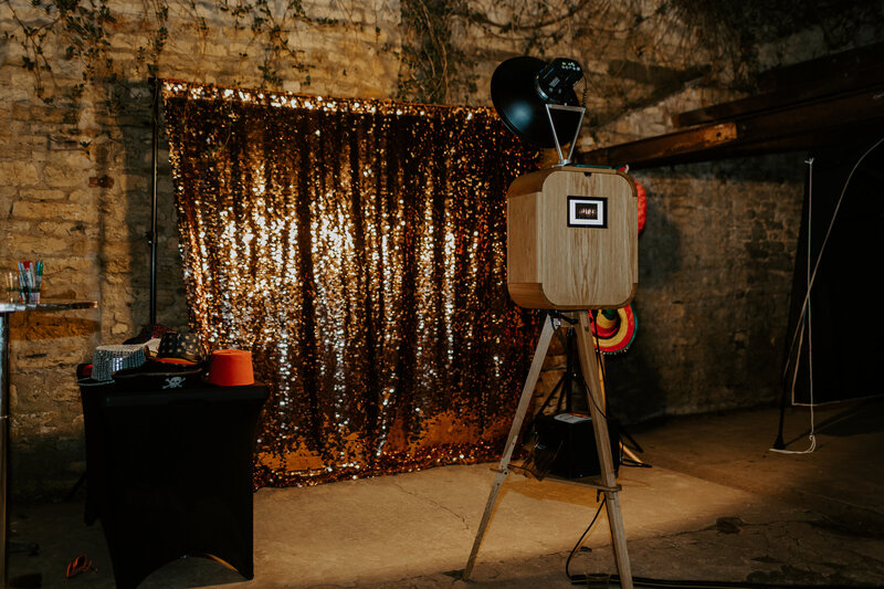 Wooden outdoor photo booth setup for a wedding party in the Cotswolds area