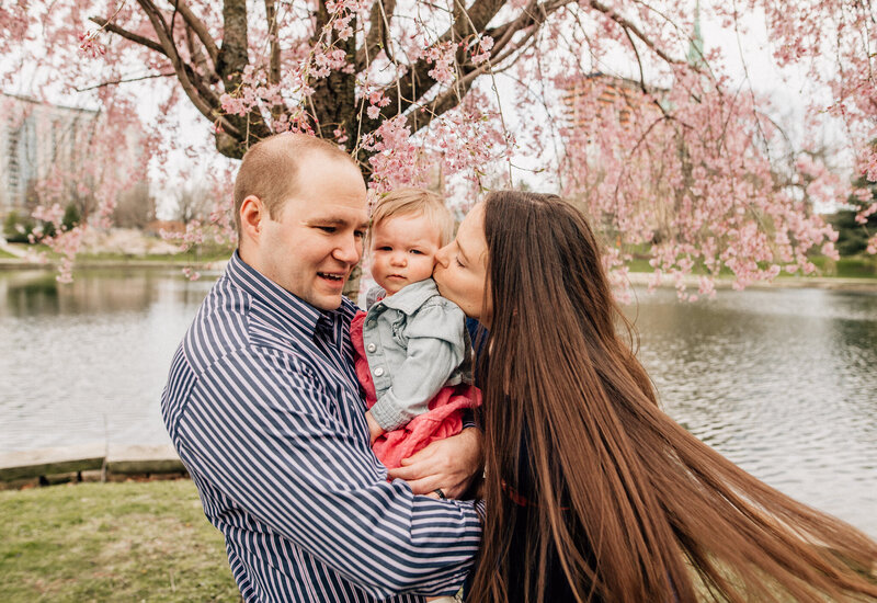 Milestone photography with mom, dad, and young baby.