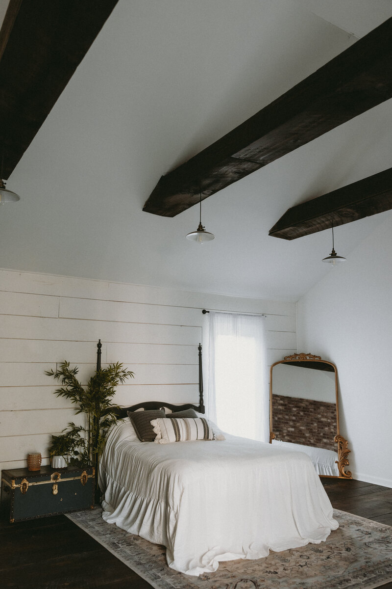 A studio space with exposed brick and original windows