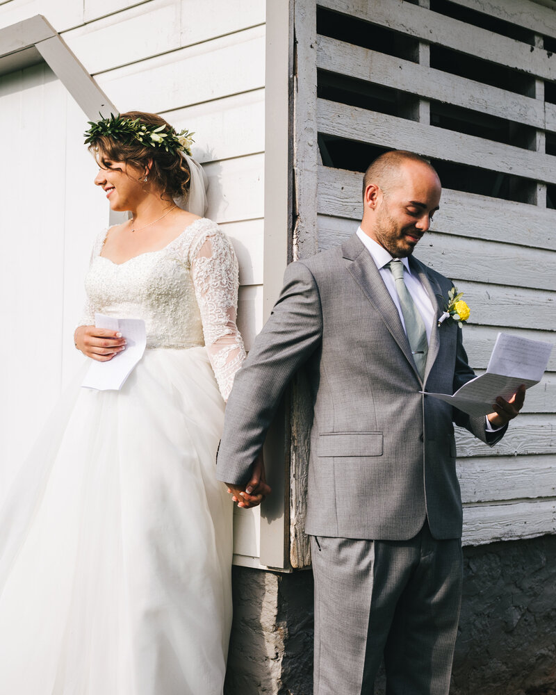 wedding photography couple reading their vows privately
