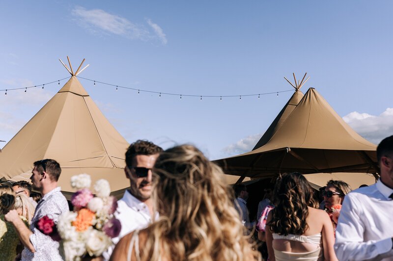 the top of element tipis setup for a wedding at the boneline in the sun