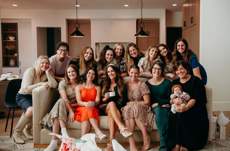 Andrea Wilde, founder and CEO of the LIVE BIG Collective leading a girls' night-- all women smiling