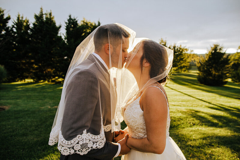 Wedding Photographer, Wedding couple under the veil