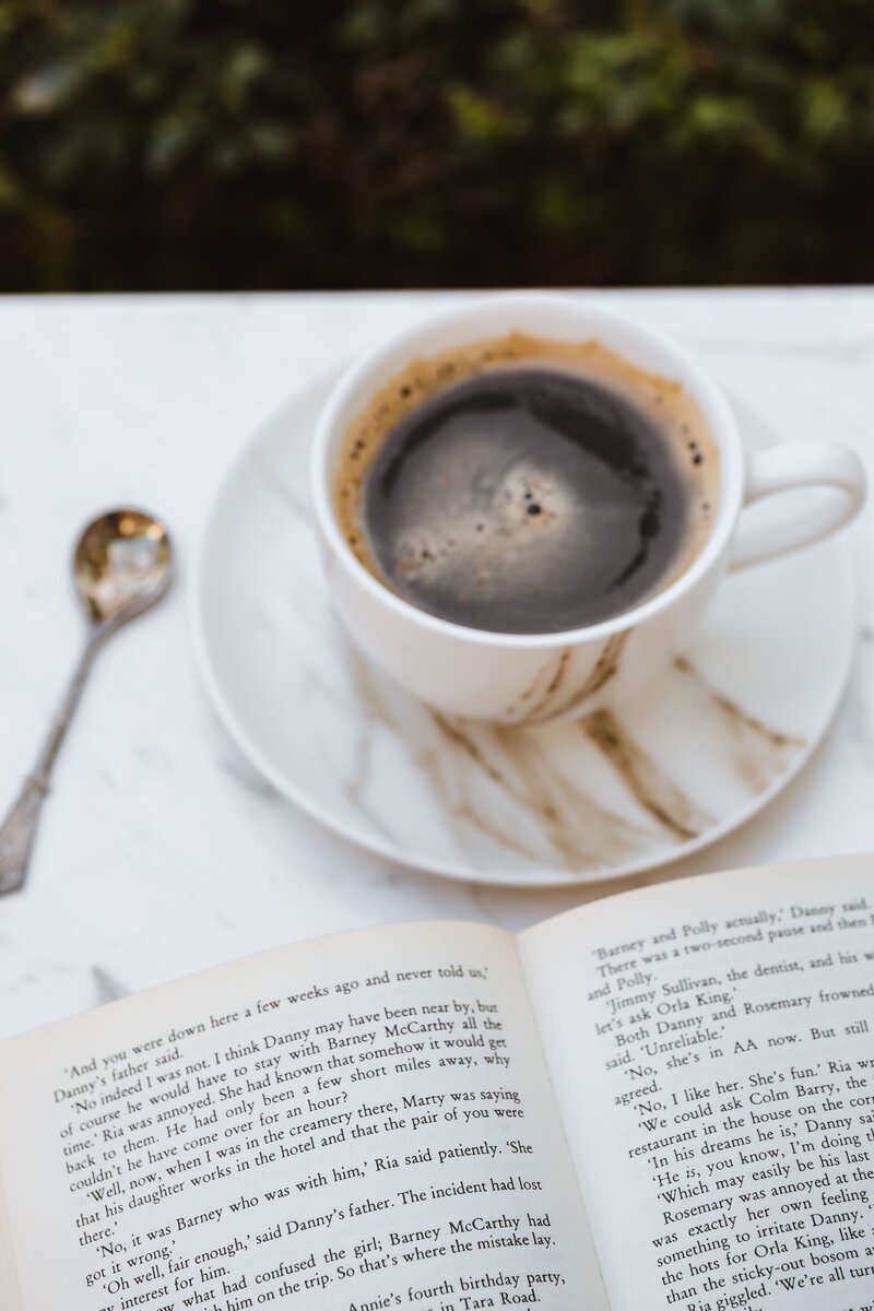 Espresso and a good book on a marble table - gives lifestyle blog vibes