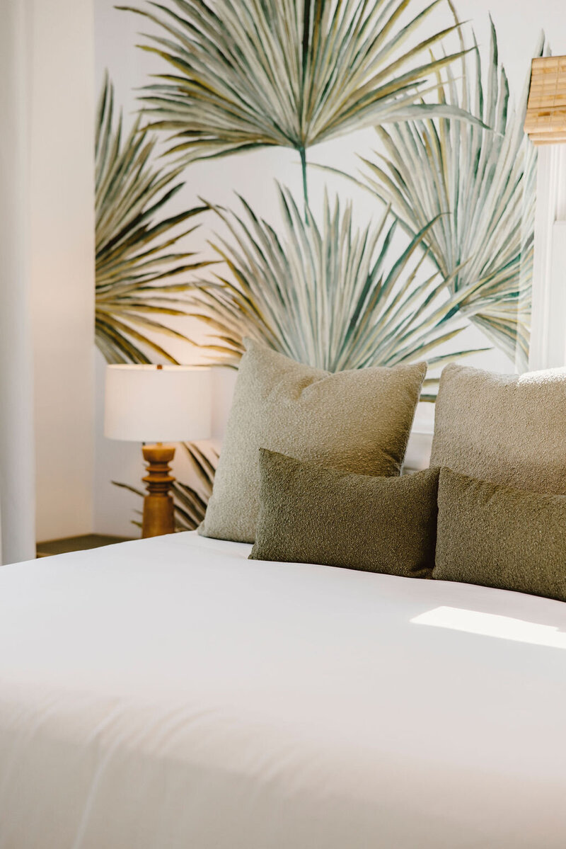 palm wallpaper green pillows
