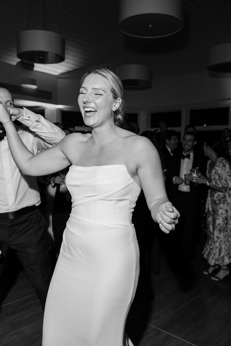 bride-laughing-strapless-wedding-gown