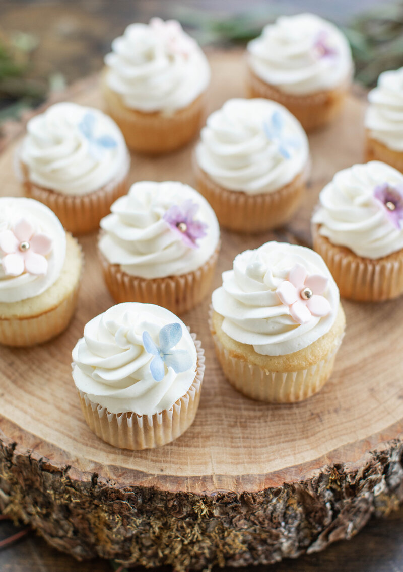 Wedding cupcakes decorated with delicate flowers