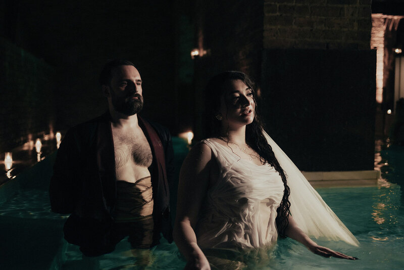 Historic first-ever wedding at any AIRE Ancient Baths location, featuring bride and groom in steamy candlelit pool in Chicago, captured by Bradi Potter
