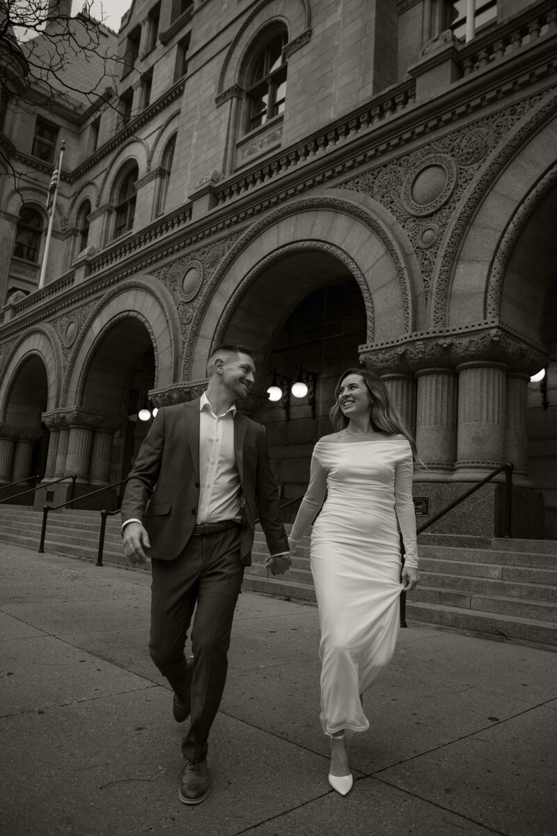 Milwaukee wedding couple walking downtown
