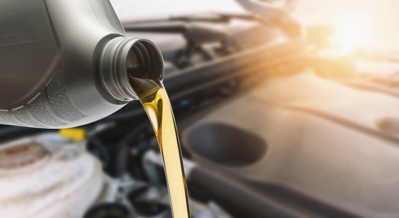 close-up-of-oil-pouring-in-car-royalty-free-image-1054347190-1540912843