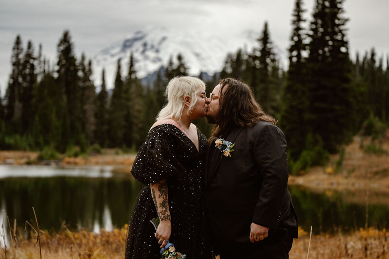 a bride and groom kiss during their washington elopement at mount rainier