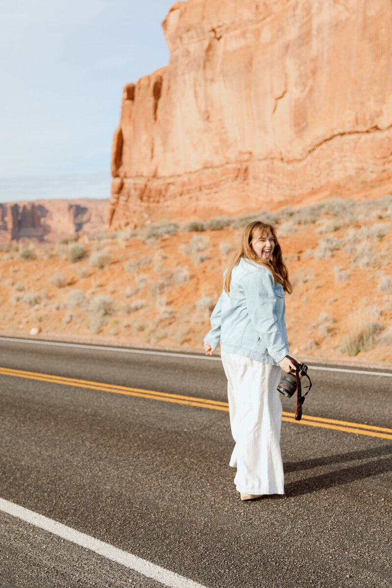 Photographer sticking tough out, enjoying the red rocks in Utah