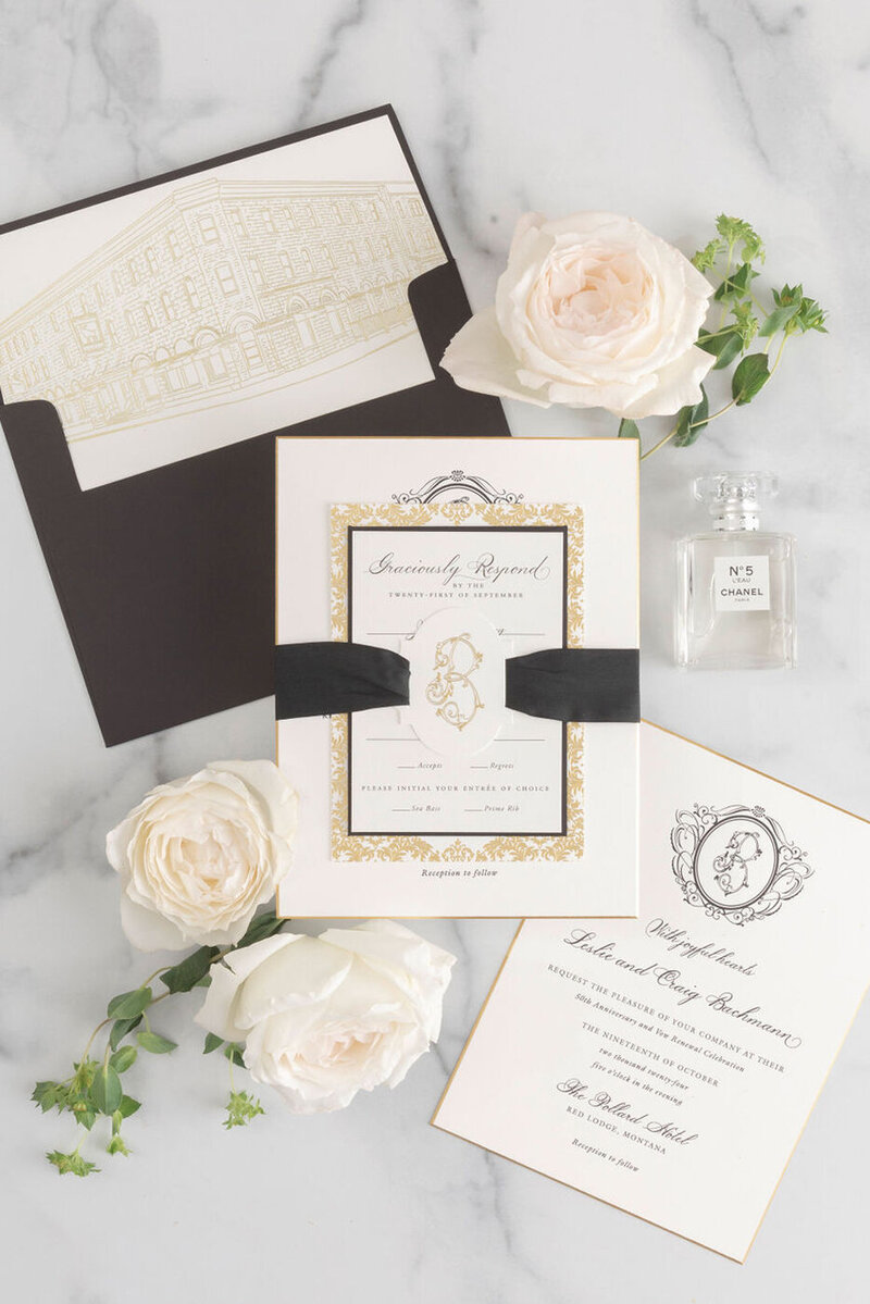Gold foil anniversary invitation with venue illustration envelope liner.