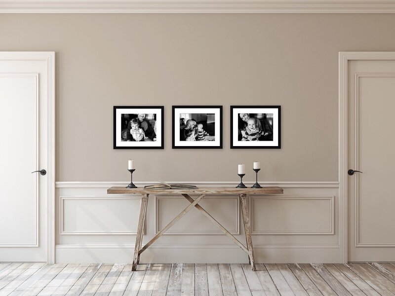 framed back and white photos on wall