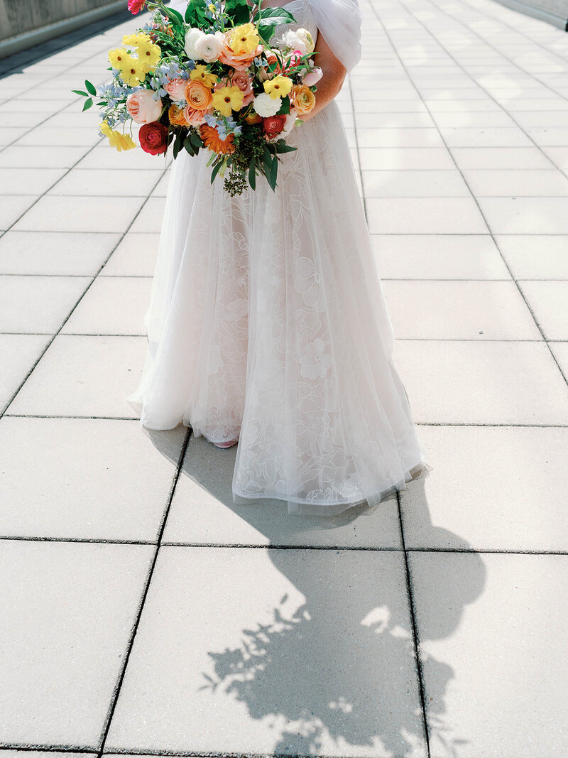 Photo of brides shadow  with her bouquet