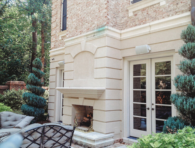 Elegant outdoor fireplace with seating