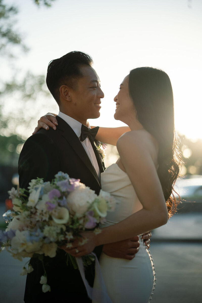 24-alisonbrynn-Radiant-LoveEvents-Maxwell-1-House-bride-laying-down-chest-up-black-hair-flowing-with-roses-flowers-drizzled-everywhere-on-hair-romantic-elegant-timeless