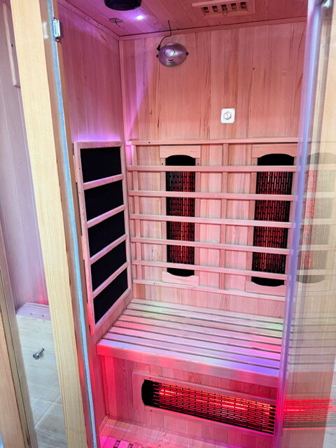 Image of a yoga teacher adopting a tree pose in the studio in Wells, Somerset