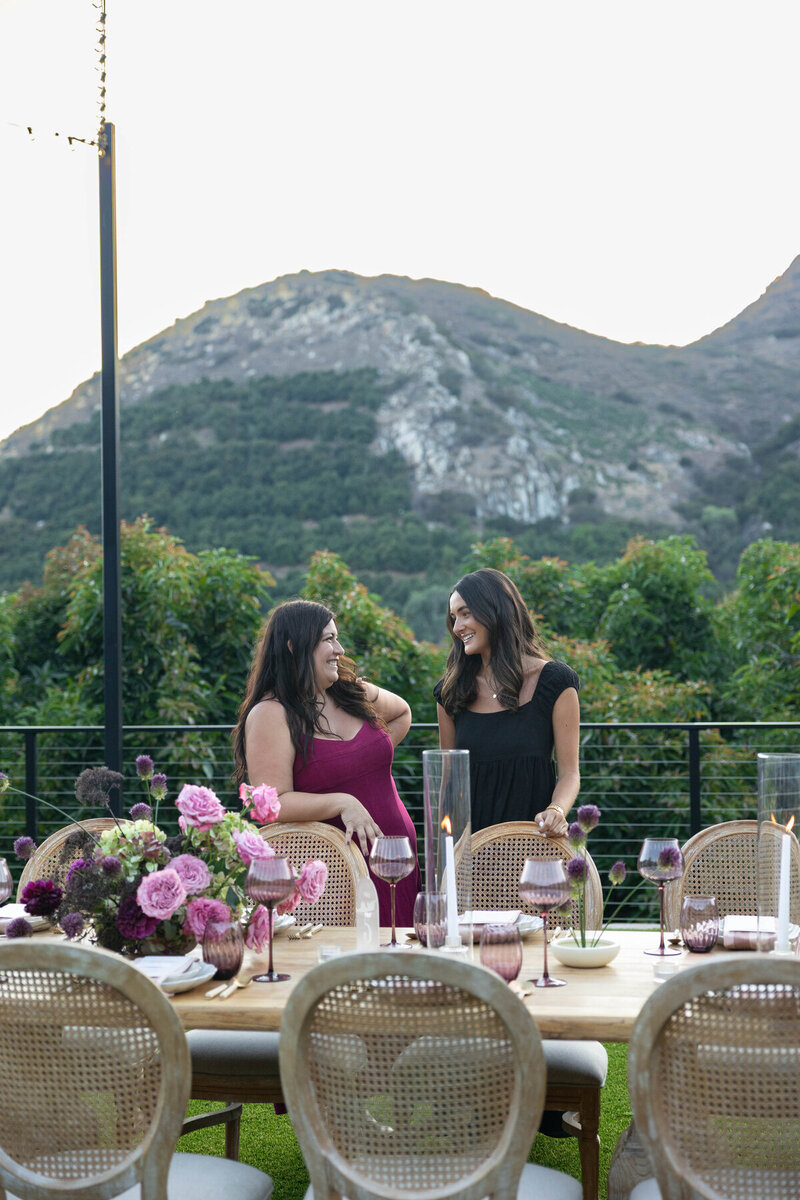 Austin events planners, Amanda and Carly at a part table they designed