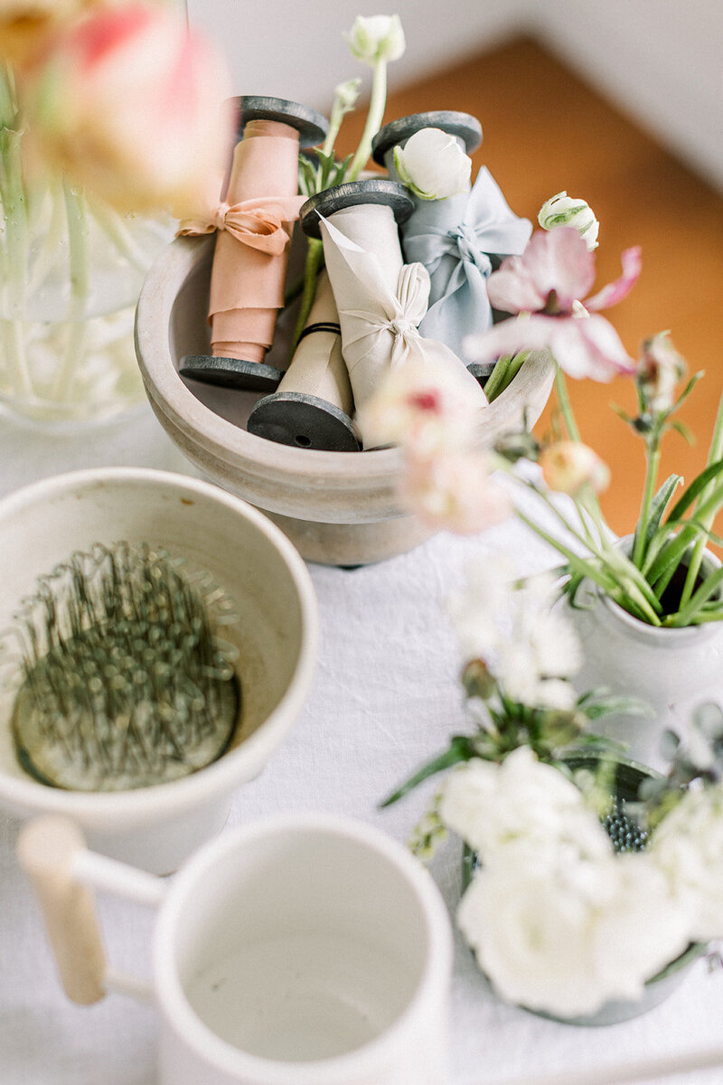 Floral design tools on a table, representing a branding portraits session by lifestyle photographer Among the Oaks. 